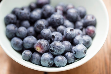 Fresh blueberries in blue bowl