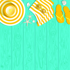 summer accessories on a blue wooden background