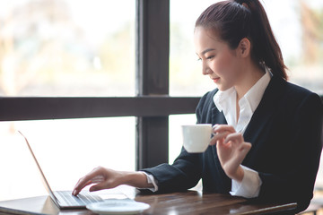 Business women drink coffee
