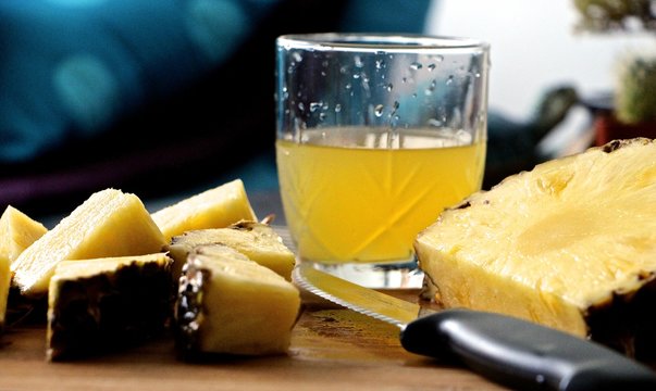 Close-up Of Pineapple Slices And Juice
