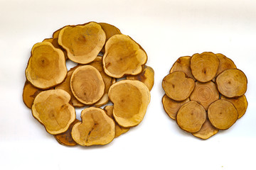 Wooden stand for juniper cups and wooden beads isolated on white background.