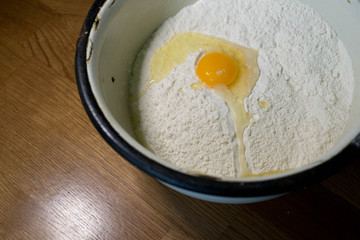 Knead the dough in an old bowl