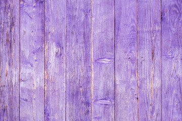 Old faded textured wooden boards with signs of paint on them.