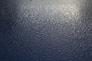 waste of water on a blue background macro