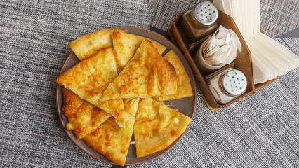 Georgian dish - Megrelian khachapuri. As a filling, young imeritin cheese is used. The salt and...