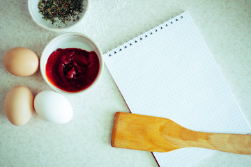 Sauces, notebook and kitchen spatula