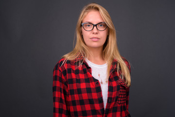 Portrait of young blond hipster woman with eyeglasses