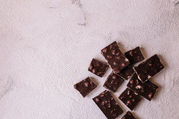 dark chocolate on a light texture background