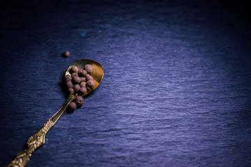 Vintage spoons and forks on a black background