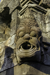 Dragon - demon head as water evacuation fountain on the wall Borobudur temple located at Magelang, Central Java, Indonesia