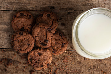 A top view of some cookies and a glass of milk