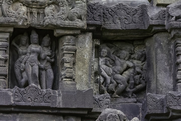 Goddesses and attractive women seducing warriors. Sculpted ladies in Prambanan Hindu Temple near...