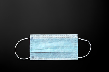 Medical mask, Medical protective mask on blue background. Disposable surgical face mask cover the...