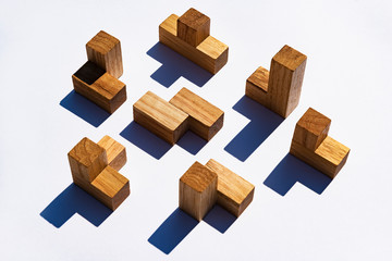 Generic wooden puzzle pieces on white