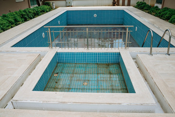 Empty swimming pool next to home. Concept summer 2020. No tourism 