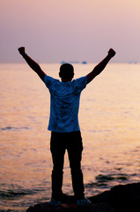 man on the beach at sunset