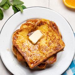 French toast with cinnamon on white background