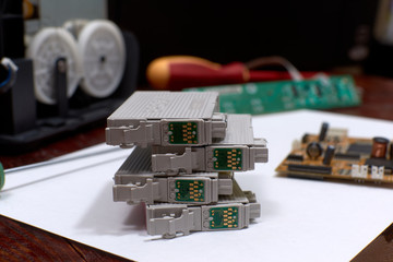 The printer is disassembled. Repair of the printer. Color ink cartridges for an inkjet printer. An...
