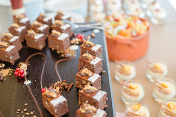 Chocolate Nut Brownie Cake decorated with Strawberries in Luxury Restaurant for Brunch, Buffet Concept