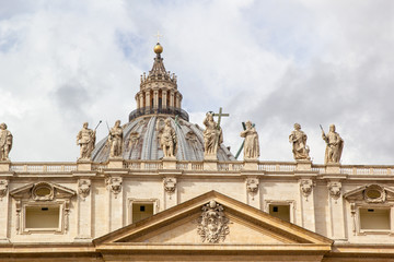 Fototapeta na wymiar Sculptures of Vatican City and St. Peter's Basilica dome
