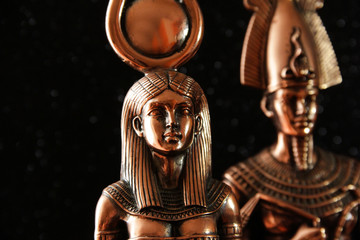 Pharaoh Tutankhamun with the goddess ISIS on a black background. Egyptian history.
