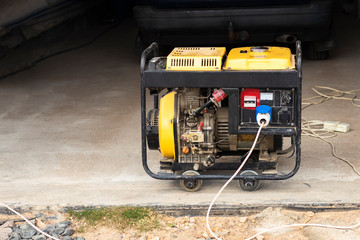 stand-alone diesel generator to supply electricity in an emergency. Yellow color. Serves not a large residential building