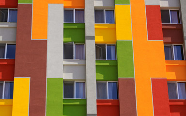 Colored building wall with apartment windows