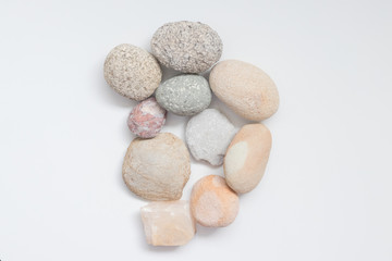 Fototapeta na wymiar Pile of Decorative Stones and Pebbles on the white background