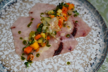 swordfish carpaccio with fruit salad. Italian food Smoked Swordfish Carpaccio.