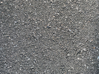 background with rough asphalt. Detailed grunge dark gray texture.