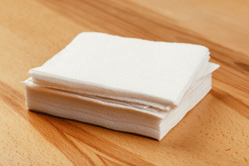 white paper napkin with a textured pattern on an old table