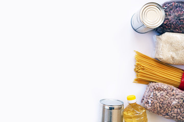 Flat lay. Donation box with food. Humanitarian assistance during the coronavirus pandemic. Box with essentials, pasta, cereals and vegetables. Banner