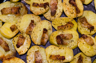 Baked potato with bacon and spices