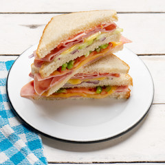 Ham sandwich with cheese on white background