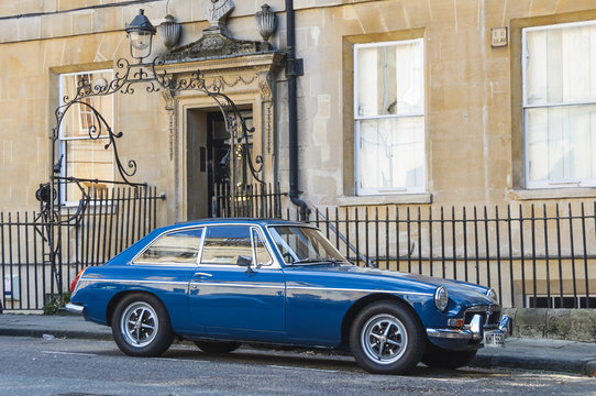 BATH, UK - CIRCA OCTOBER 2011: A blue MG MGB GT parked in the street.