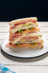 Ham sandwich with cheese on white background