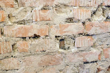 Background of curved brickwork with old cement and holes.