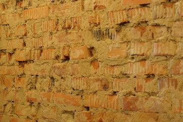 Background loft of a curve red brickwork with old cement perspective