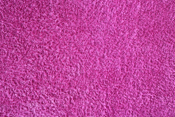 flat pink fabric of a soft towel - closeup background texture