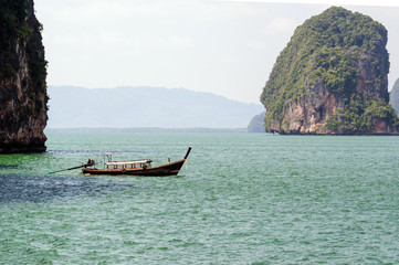 Fototapeta na wymiar Traditional Thai longtail boats in the Andaman sea.