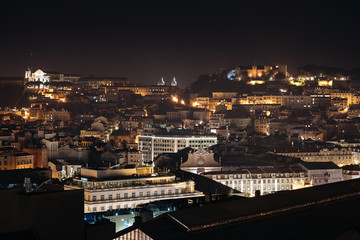 Lisbon cityscape and Saint George 'Sao Jorge' Castle, night view from Sao Pedro de Alcantara in Lisbon, Portugal