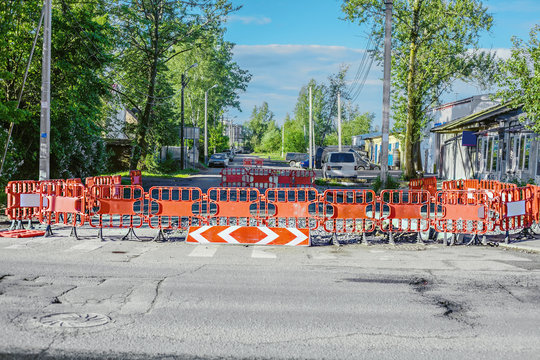 The Road Is Blocked By Red Fencing Blocks