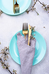 Spring table setting with blooming branch