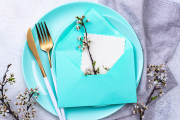 Spring table setting with envelope