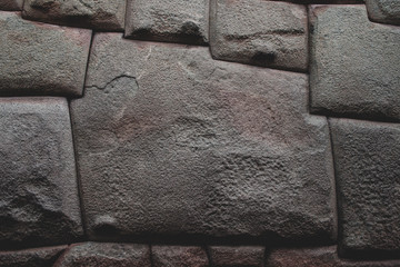 Famous Inca angled stone in Hatun Rumiyoc wall, an archeological artefact in Cuzco, Peru. It was part of a stone wall of an Inca palace, and is considered to be a national heritage object Cusco