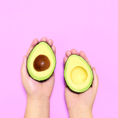 Avocado with a pink background