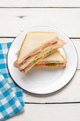 Ham sandwich with cheese on white background