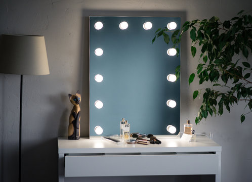 makeup mirror and cosmetics in the white dressing room with a tree and  floor lamp Stock Photo | Adobe Stock