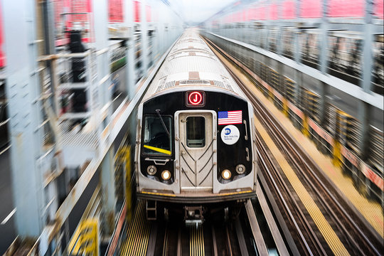 Metro Train Over Railroad Tracks