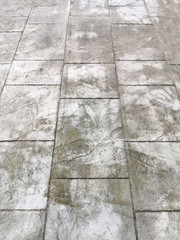 
gray with white spots cement road tiled